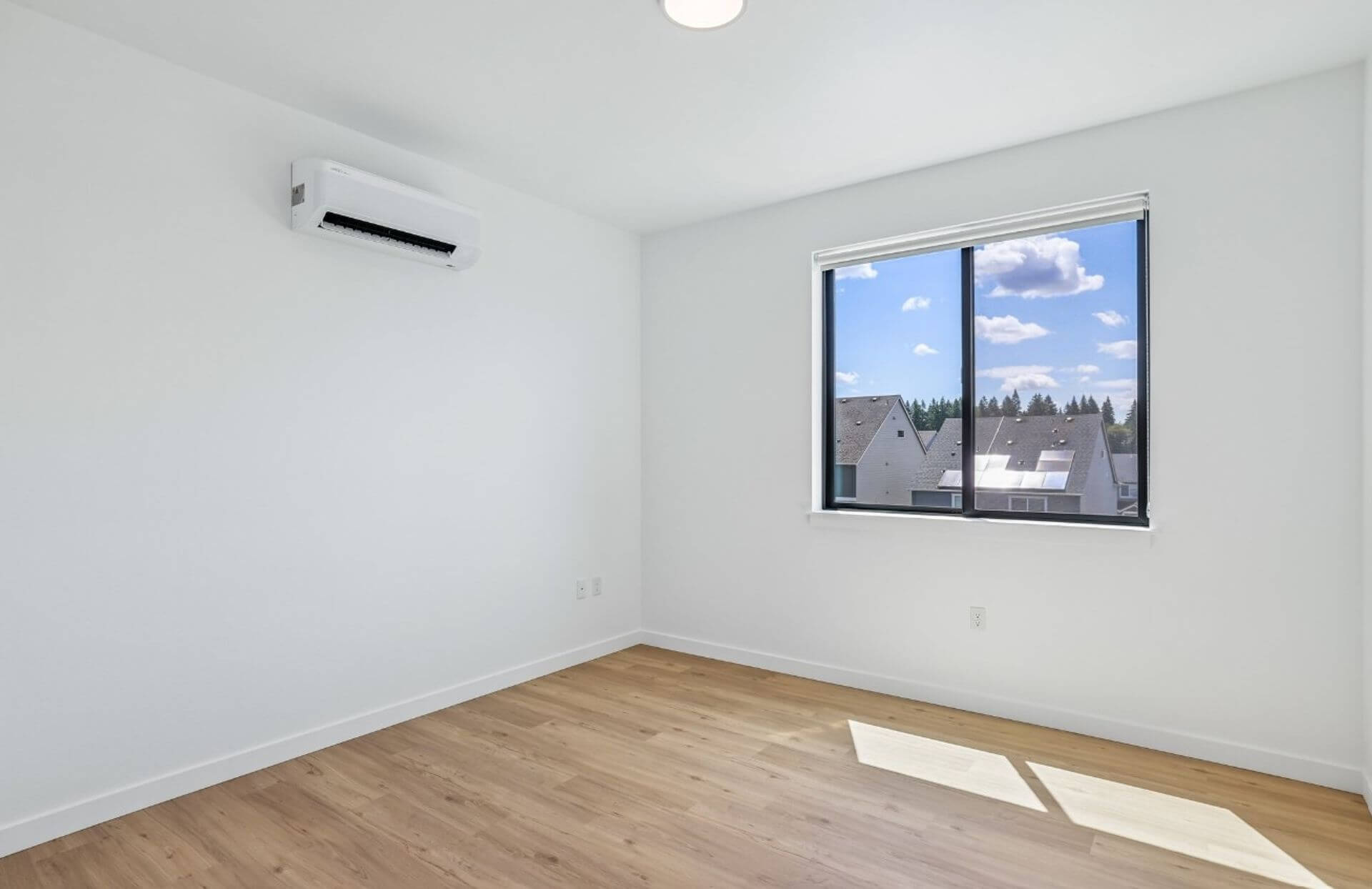 Bedroom with multi-split heating and cooling unit in an Abbey Creek Square residence